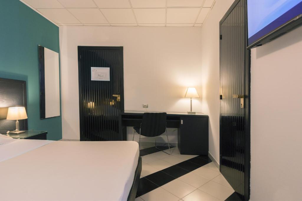 Postel nebo postele na pokoji v ubytování Executive Business Hotel