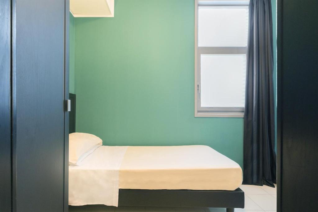 Postel nebo postele na pokoji v ubytování Executive Business Hotel