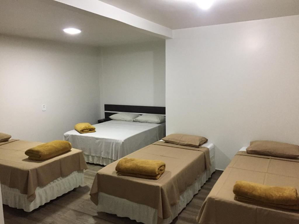 Postel nebo postele na pokoji v ubytování Hotel Paradizzo