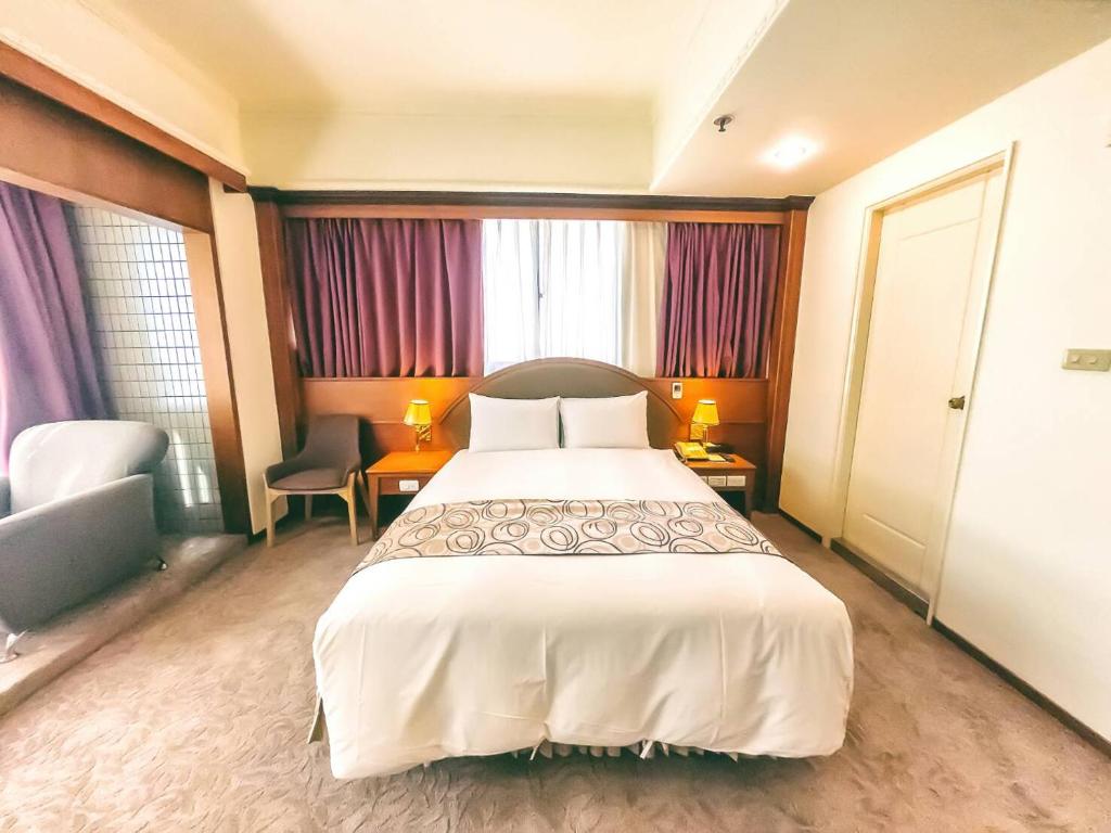 Postel nebo postele na pokoji v ubytování Foung Jia Hotel