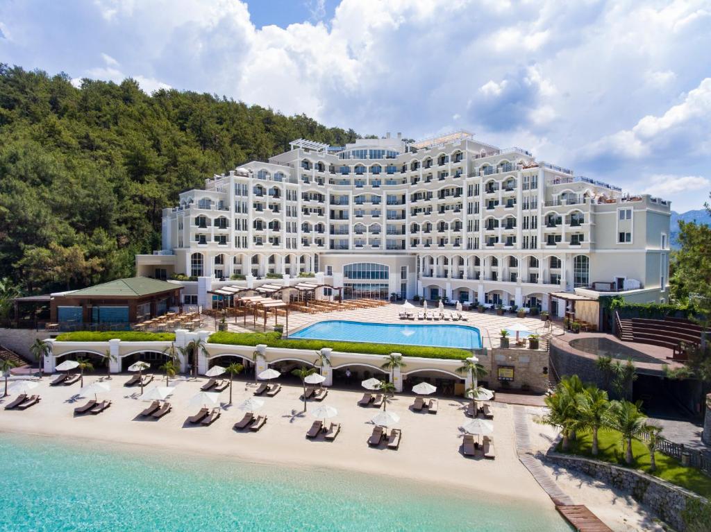 an aerial view of a hotel with chairs and a pool at Angel's Marmaris Hotel in Turgut