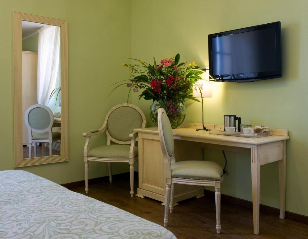 TV a/nebo společenská místnost v ubytování Relais Corte Cavalli