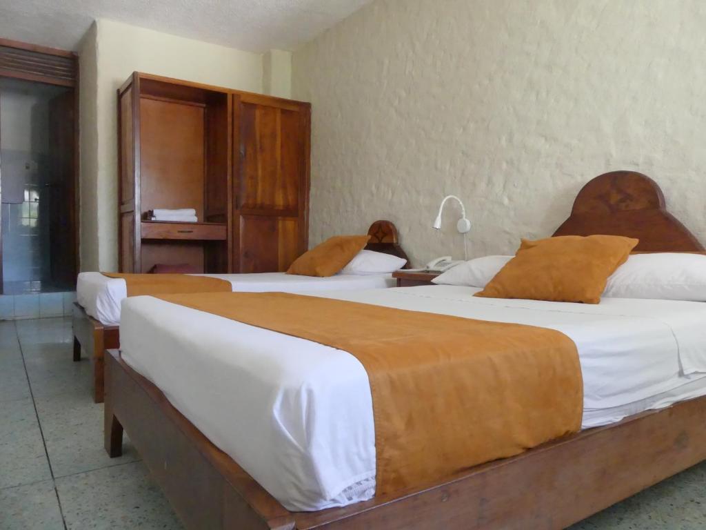 Postel nebo postele na pokoji v ubytování Hostal Estrella de Mar