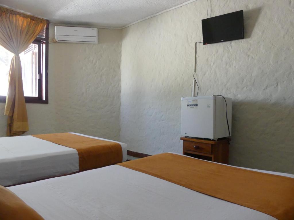 Postel nebo postele na pokoji v ubytování Hostal Estrella de Mar