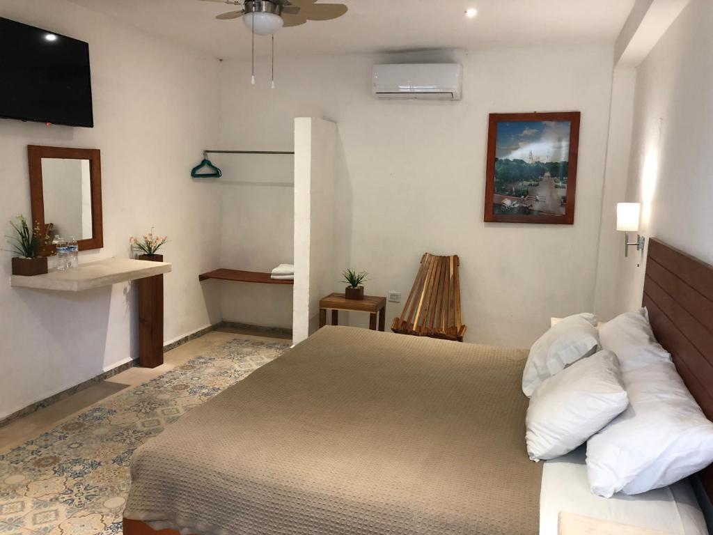 Postel nebo postele na pokoji v ubytování Hotel Casa Bamboo