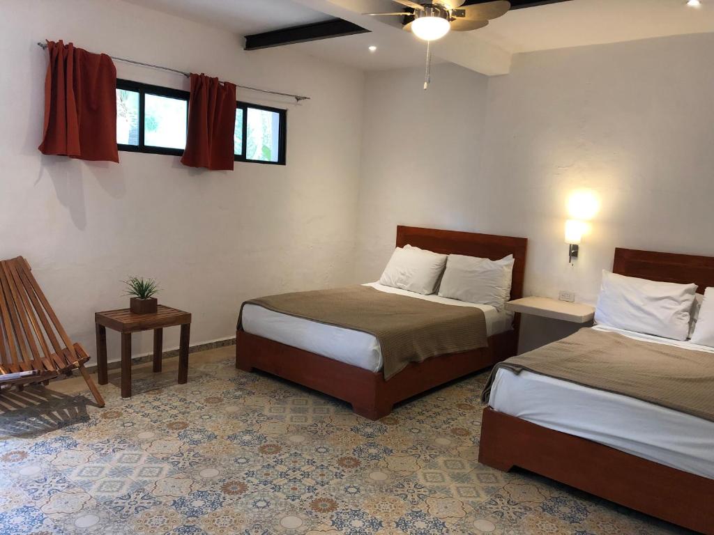 Postel nebo postele na pokoji v ubytování Hotel Casa Bamboo