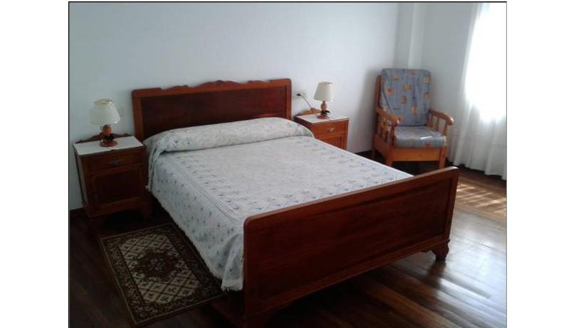 A bed or beds in a room at Hostal Pumar