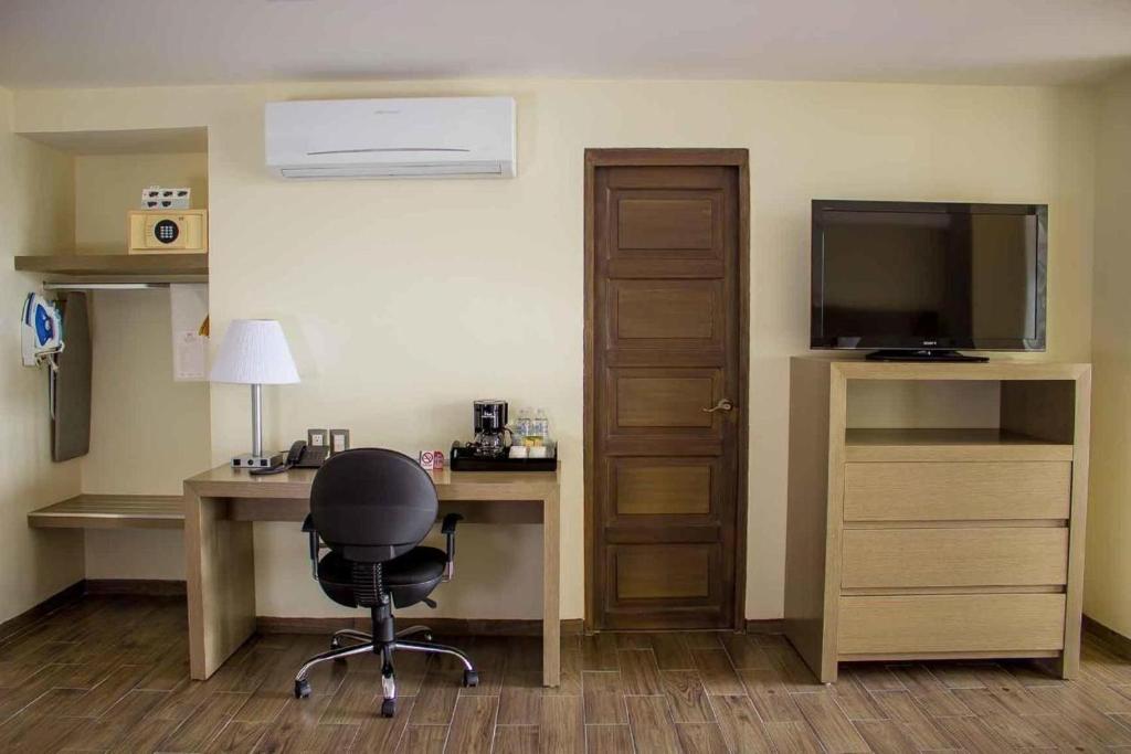 TV a/nebo společenská místnost v ubytování Hotel Mansur Business & Leisure