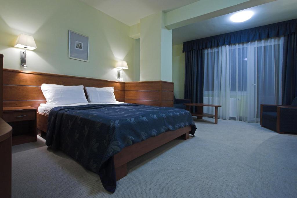 Cama o camas de una habitación en Benczur Hotel