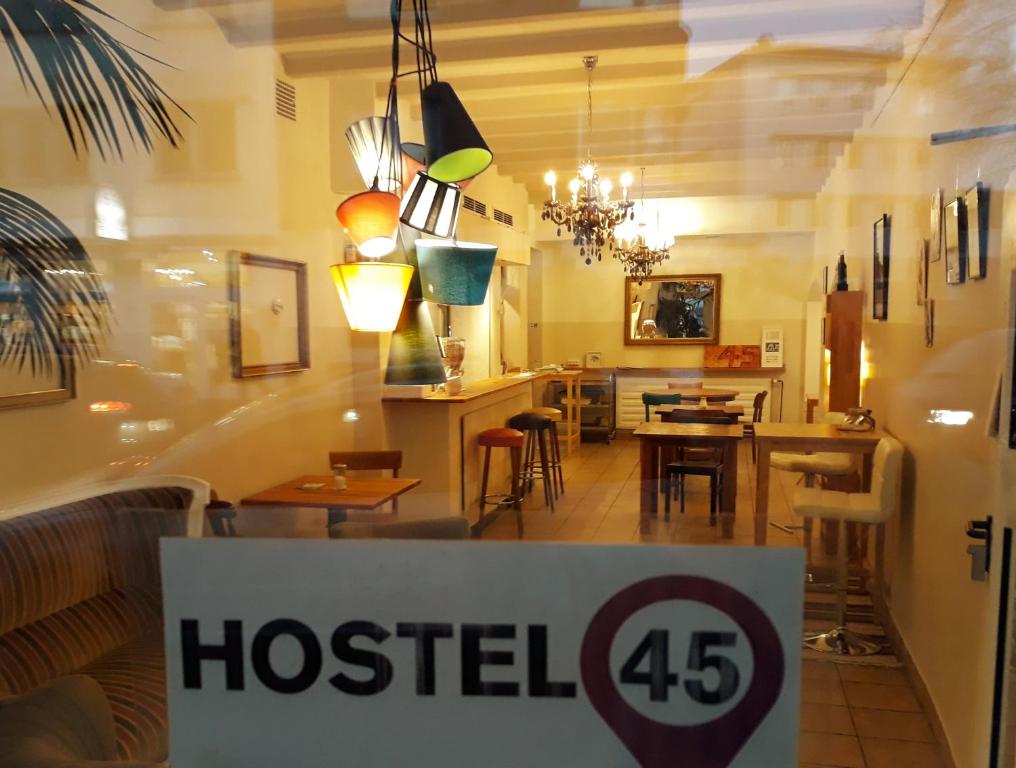 a hotel sign in front of a living room at Hostel 45 in Bonn