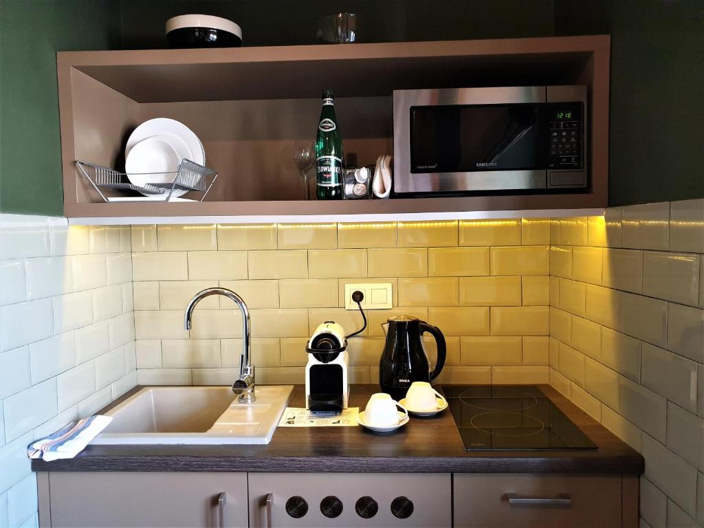 Kuchyň nebo kuchyňský kout v ubytování SleepWell Apartments Ordynacka