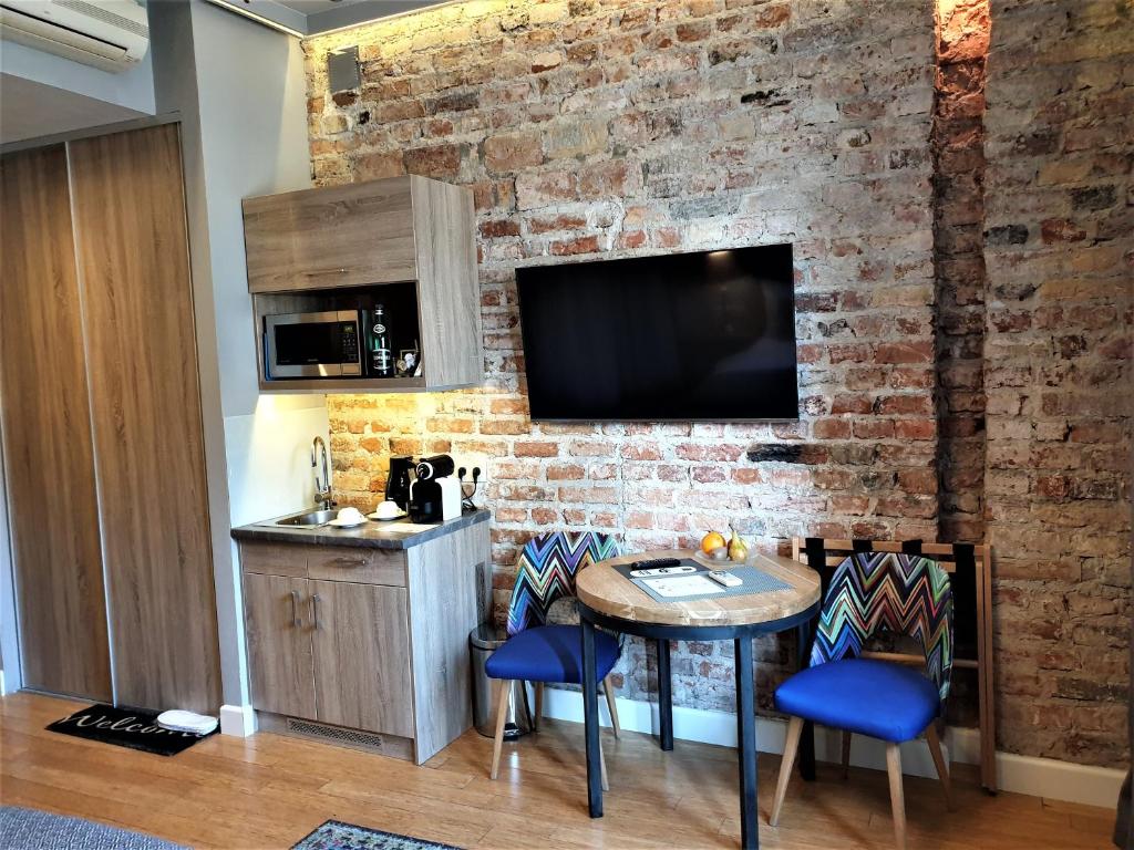 Kuchyň nebo kuchyňský kout v ubytování SleepWell Apartments Ordynacka