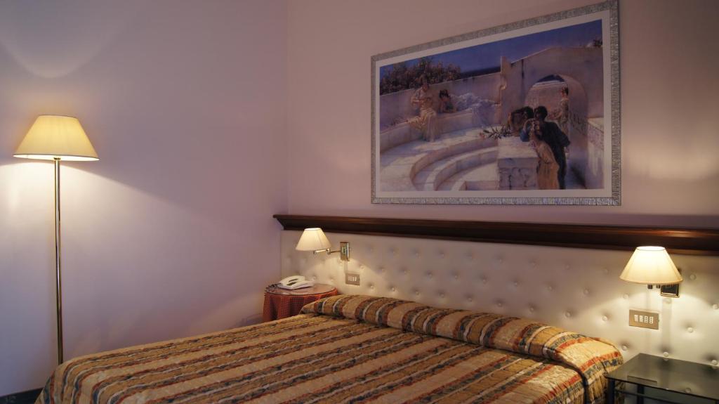Postel nebo postele na pokoji v ubytování Hotel Torretta