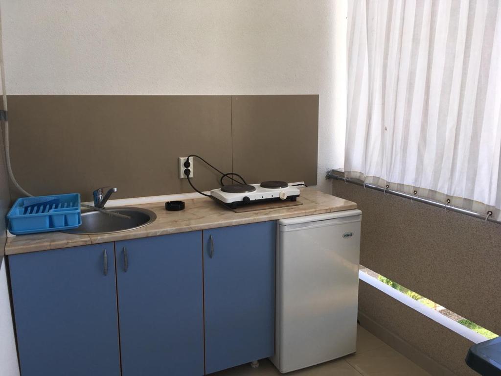 Kuchyň nebo kuchyňský kout v ubytování Apartmani Vuković
