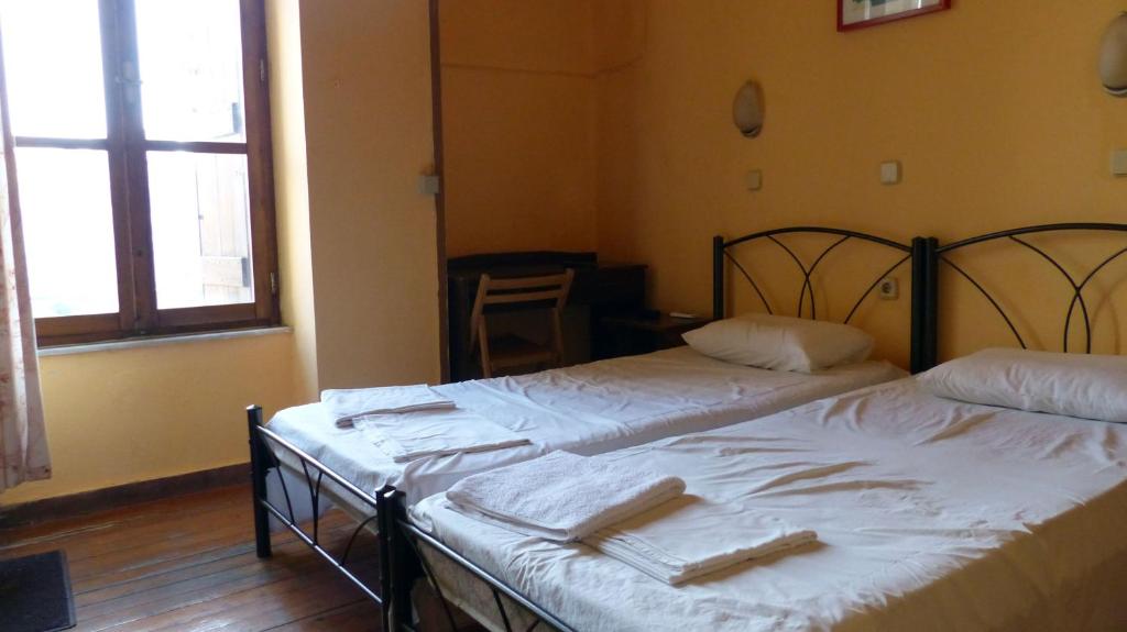 Postel nebo postele na pokoji v ubytování Kydonia Rooms