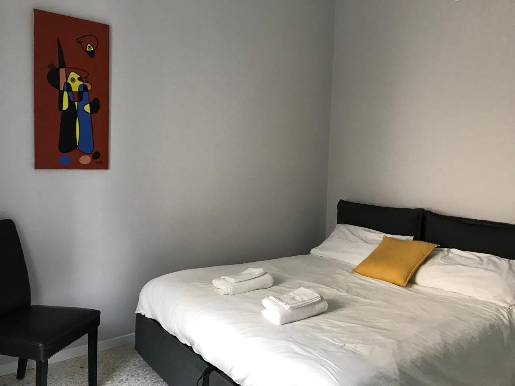 Łóżko lub łóżka w pokoju w obiekcie Dimora San Camillo