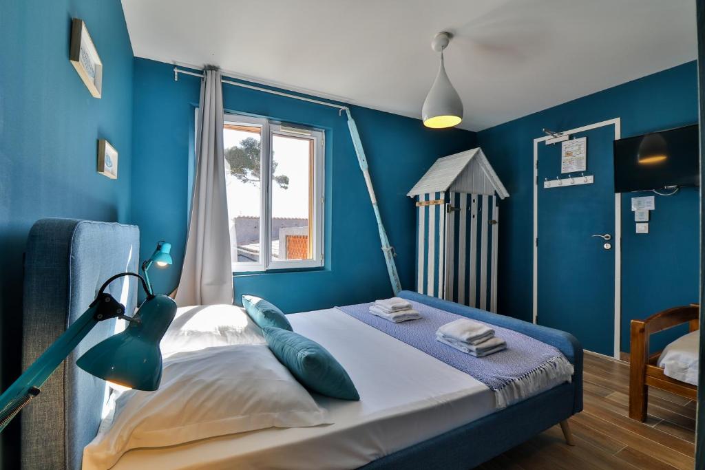 Postel nebo postele na pokoji v ubytování Hôtel La Bastide