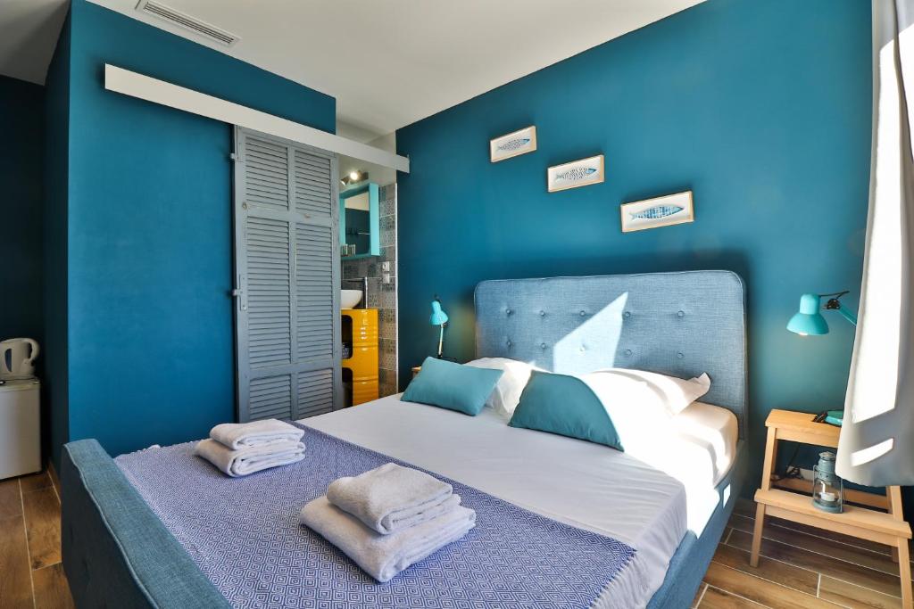 Postel nebo postele na pokoji v ubytování Hôtel La Bastide