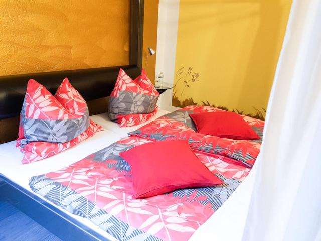 Postel nebo postele na pokoji v ubytování Hotel Feldmaus