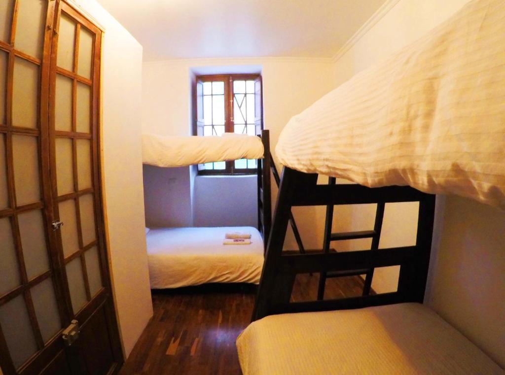 Postel nebo postele na pokoji v ubytování Arche Noah Boutique Hostel