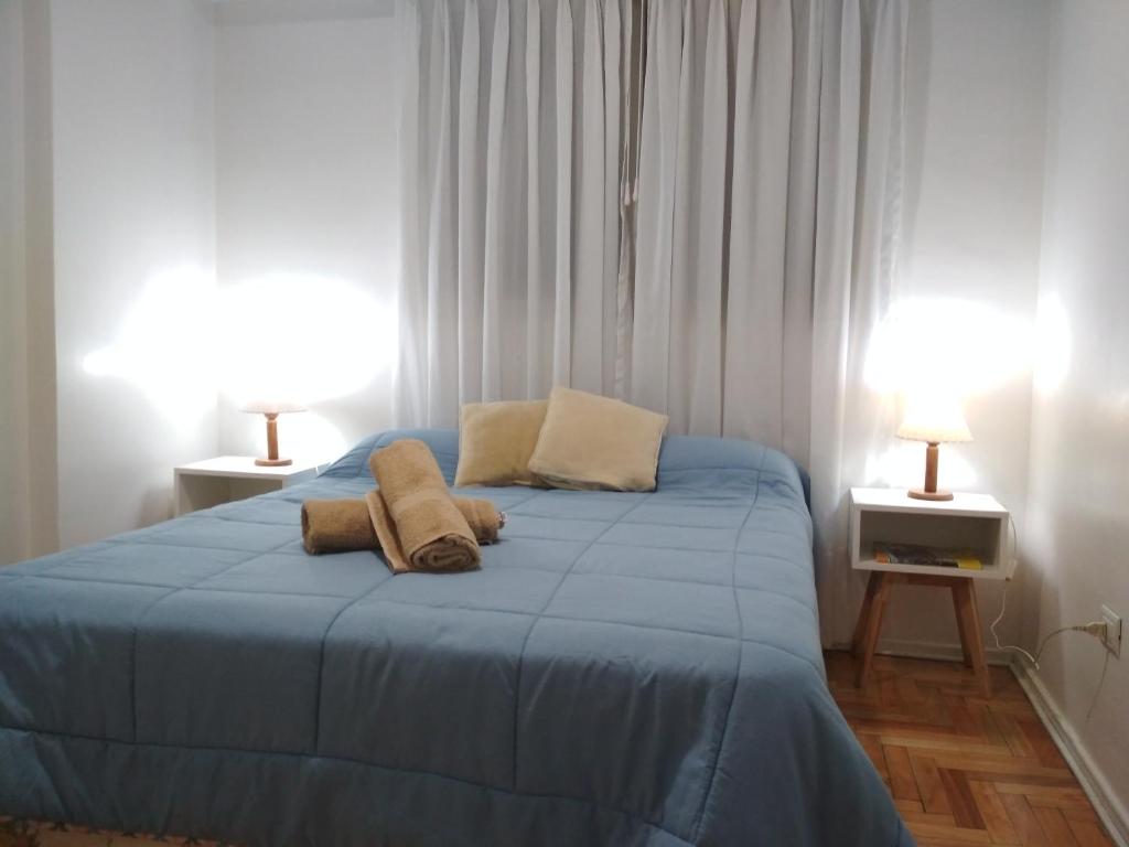 Una cama o camas en una habitación de Apartment City Center Recoleta