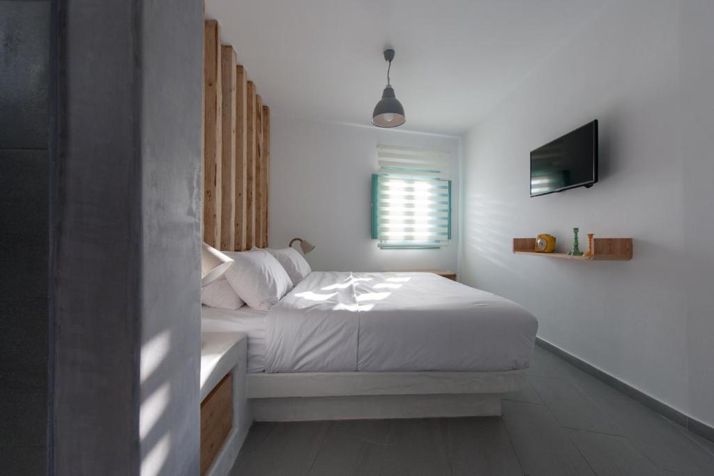 Letto o letti in una camera di Avatar Suites