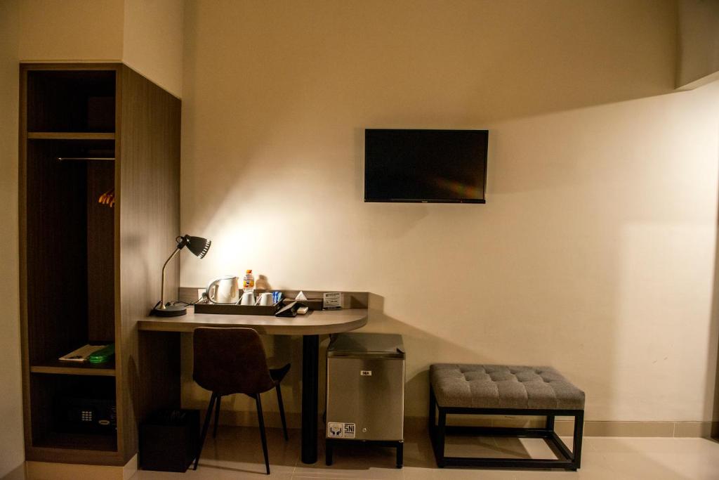 TV a/nebo společenská místnost v ubytování Grand Padis Hotel