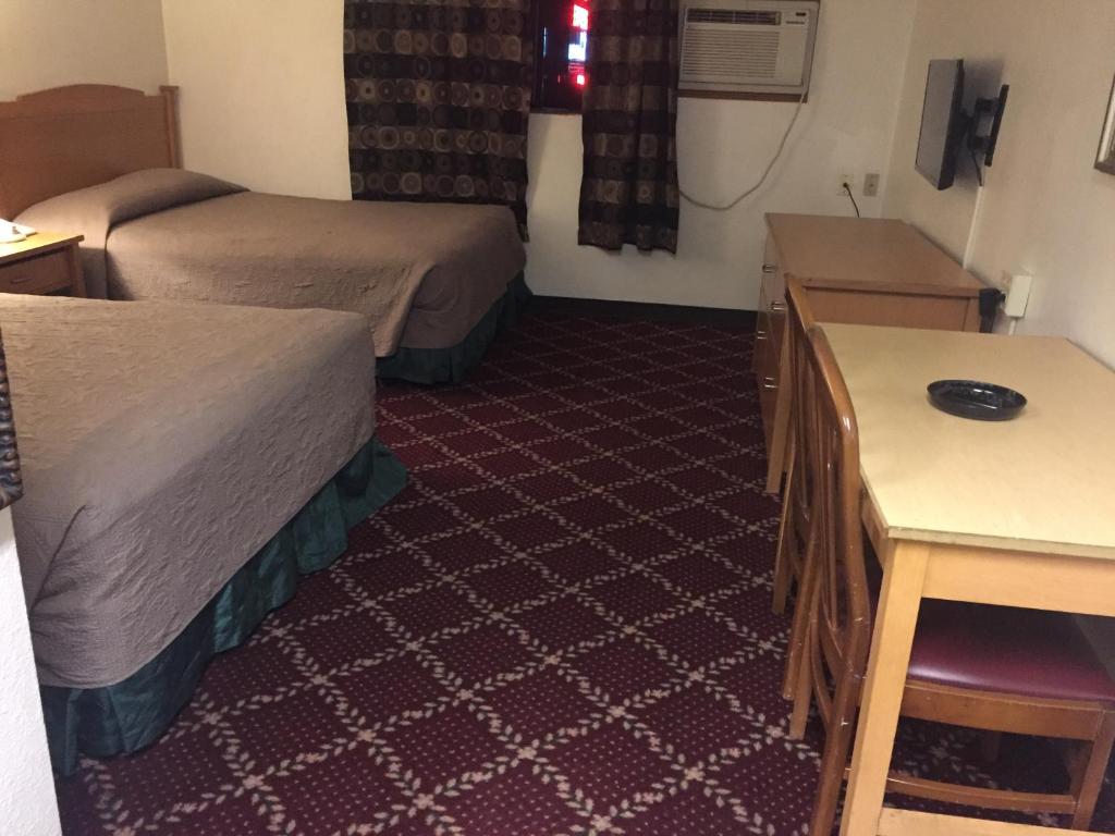 Postel nebo postele na pokoji v ubytování Motel express