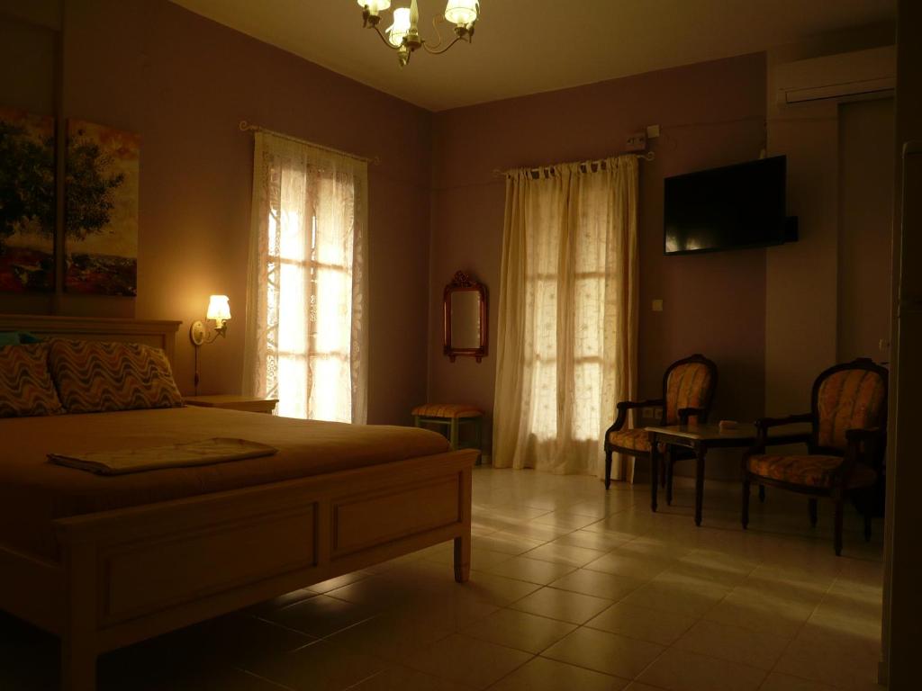 TV a/nebo společenská místnost v ubytování Ifigenia's Rooms