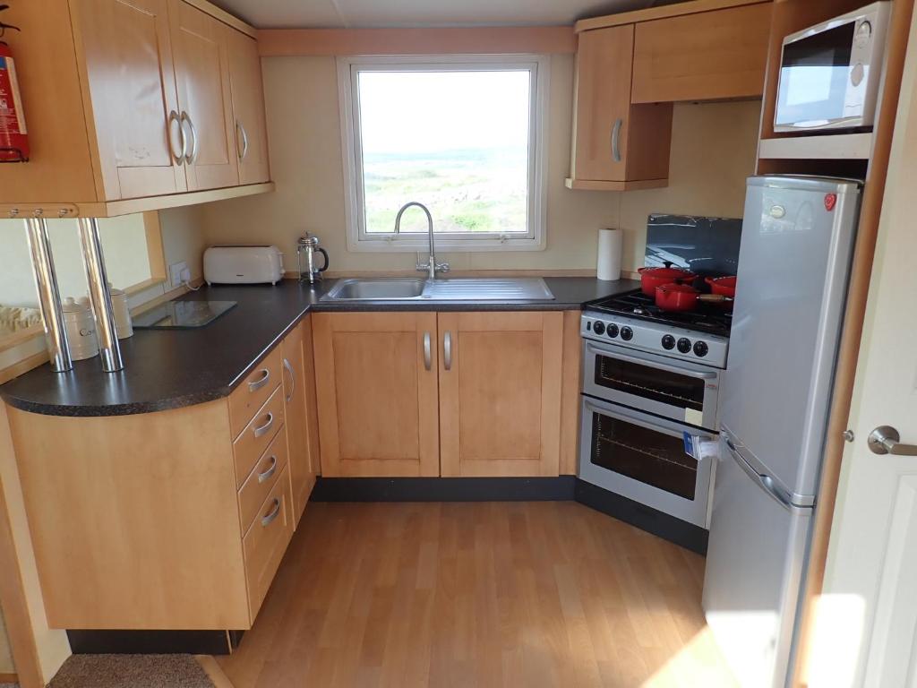 Cucina o angolo cottura di Earls View Caravan