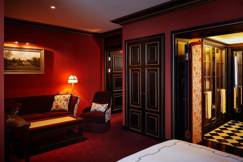 Postel nebo postele na pokoji v ubytování L'Escape Hotel