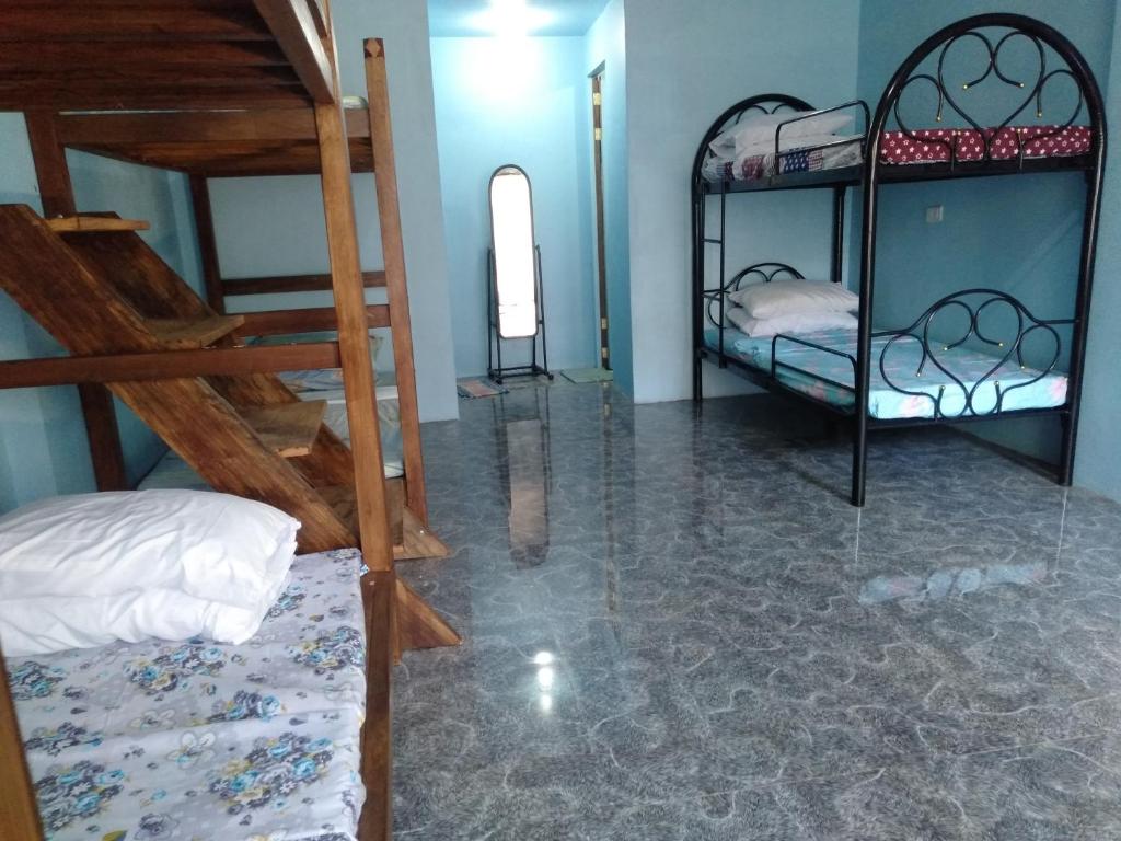 Postel nebo postele na pokoji v ubytování Carillo guest house