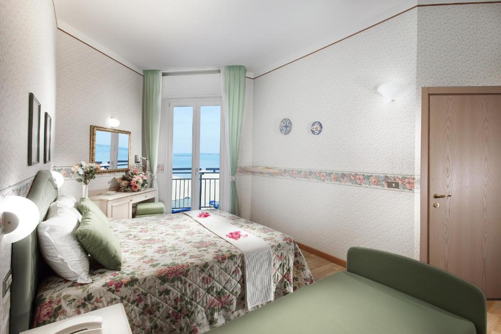 Postel nebo postele na pokoji v ubytování Hotel Sporting
