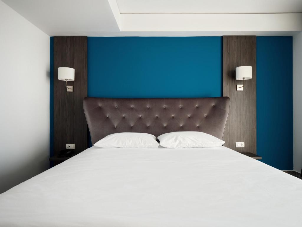 Postel nebo postele na pokoji v ubytování Boutique Hotel Portorose