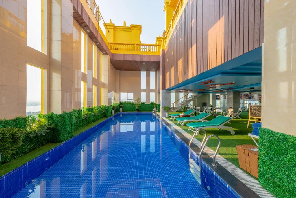 a swimming pool in the middle of a building at Fivitel Boutique Da Nang in Da Nang
