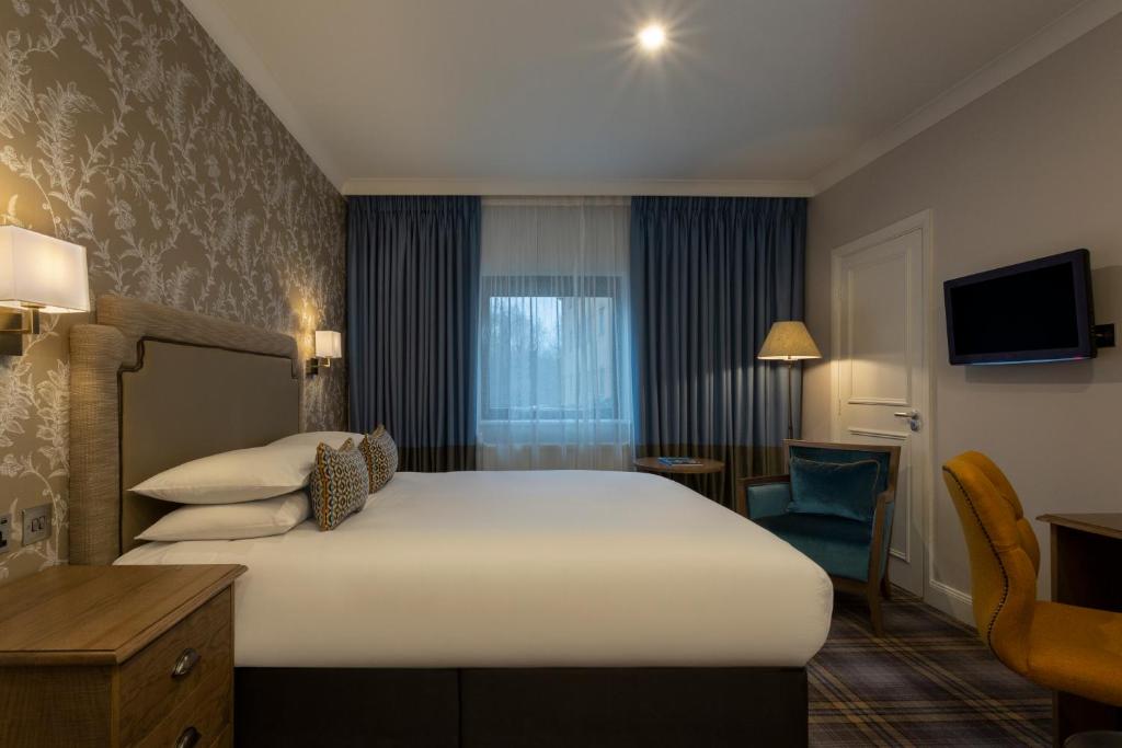 En eller flere senge i et værelse på Bridgewood Manor Hotel & Spa