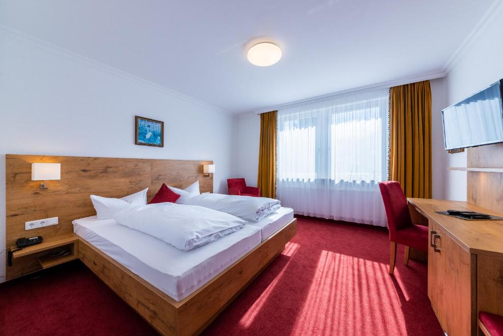Letto o letti in una camera di Hotel Krone