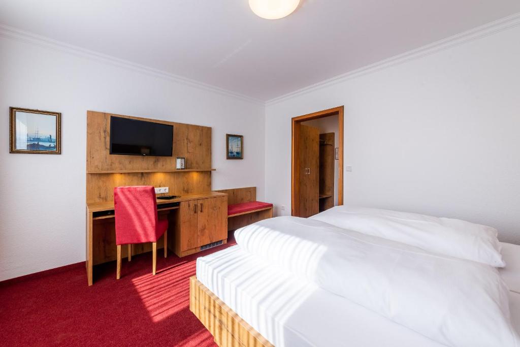 Letto o letti in una camera di Hotel Krone