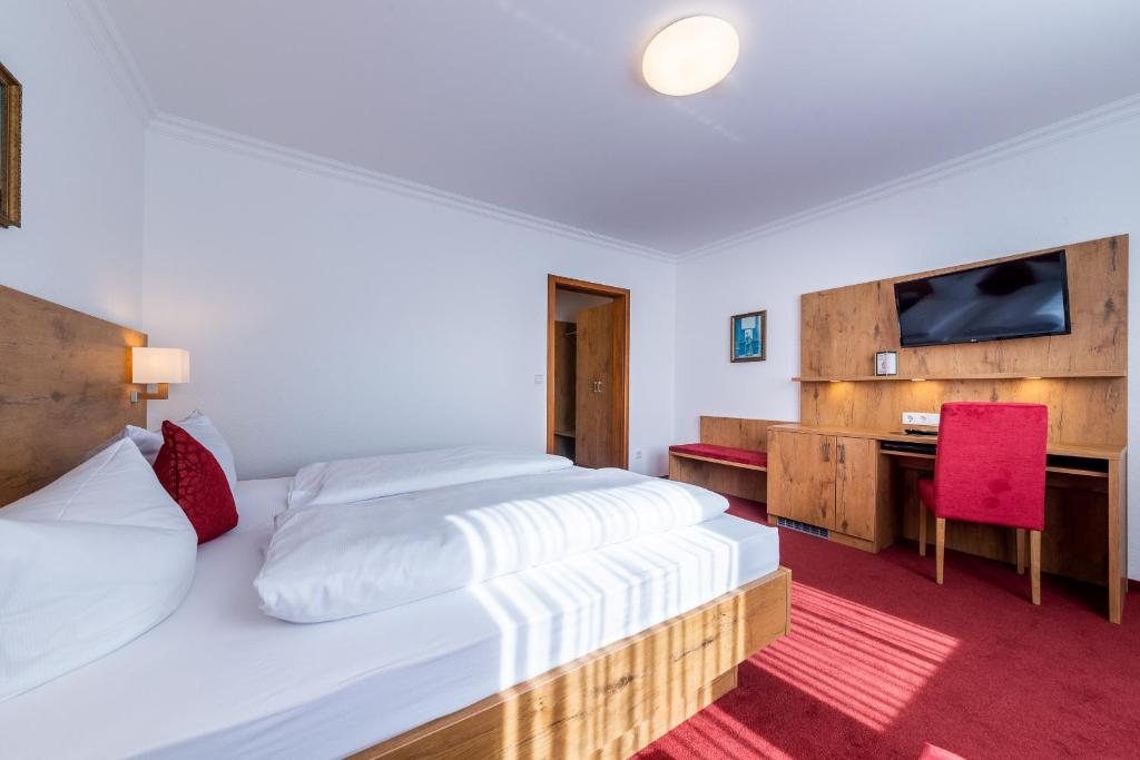 Letto o letti in una camera di Hotel Krone