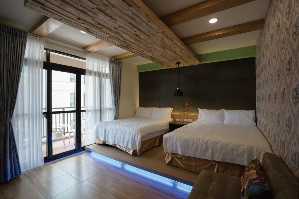 Postel nebo postele na pokoji v ubytování 愛丁堡集團市區精品及國王雙館民宿Edinburgh Boutique Hotel