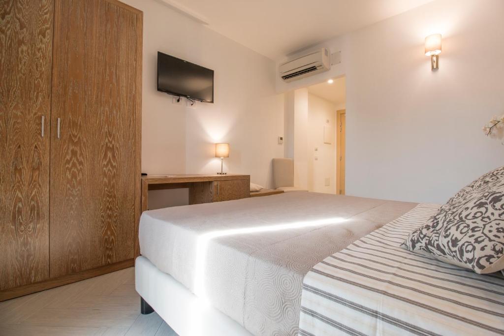 Postel nebo postele na pokoji v ubytování Hotel Maria