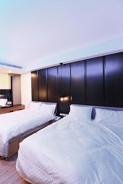 Postel nebo postele na pokoji v ubytování 愛丁堡集團市區精品及國王雙館民宿Edinburgh Boutique Hotel