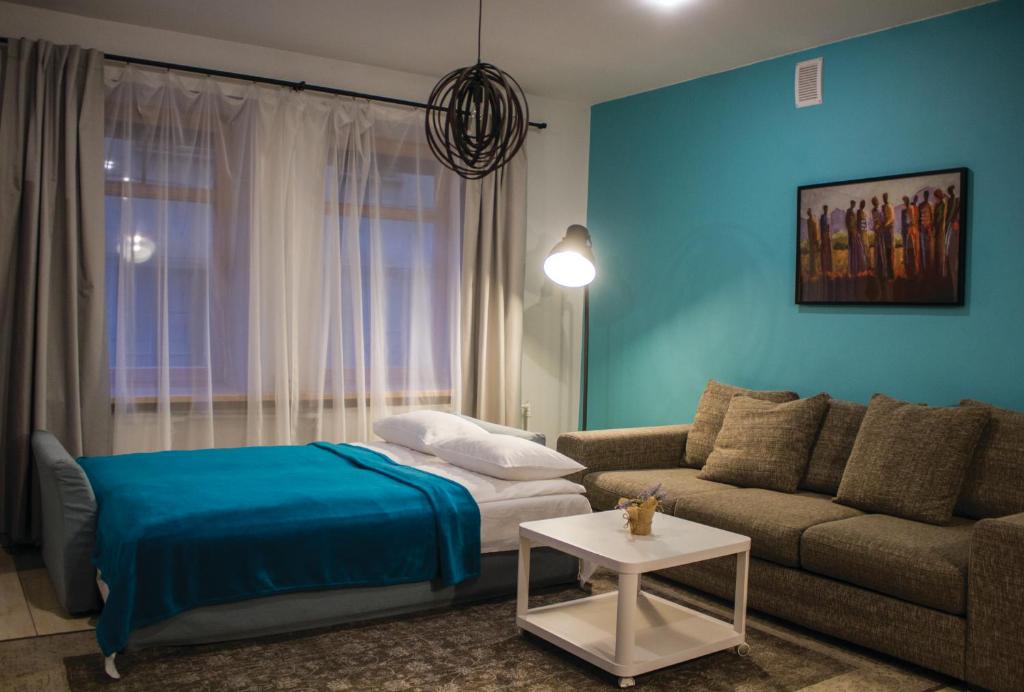 מיטה או מיטות בחדר ב-Kaunas Old Town Apartment