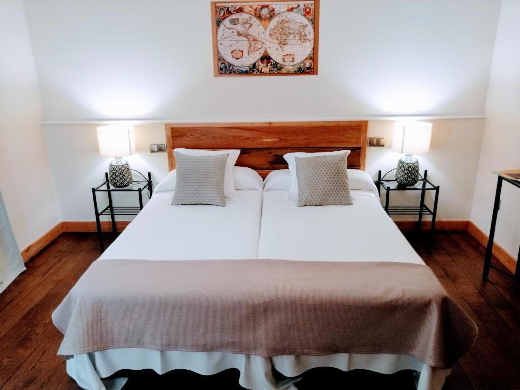 Postel nebo postele na pokoji v ubytování Palacio de Arce
