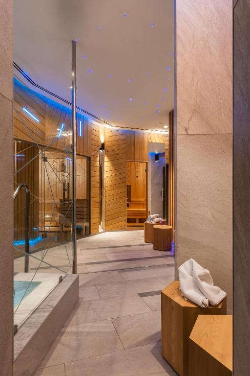 a lobby of a hotel with a glass wall at Ensana Thermal Hévíz in Hévíz
