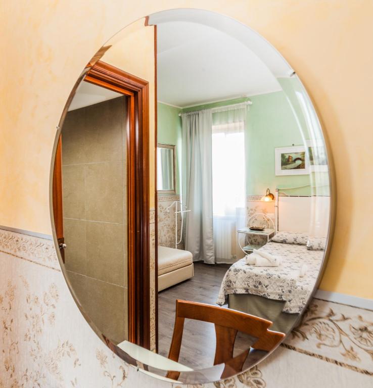 Postel nebo postele na pokoji v ubytování Albergo Della Corte