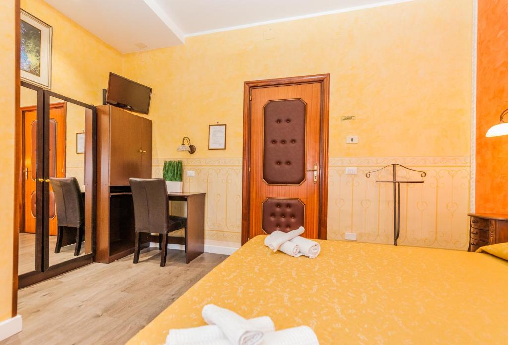 Postel nebo postele na pokoji v ubytování Albergo Della Corte