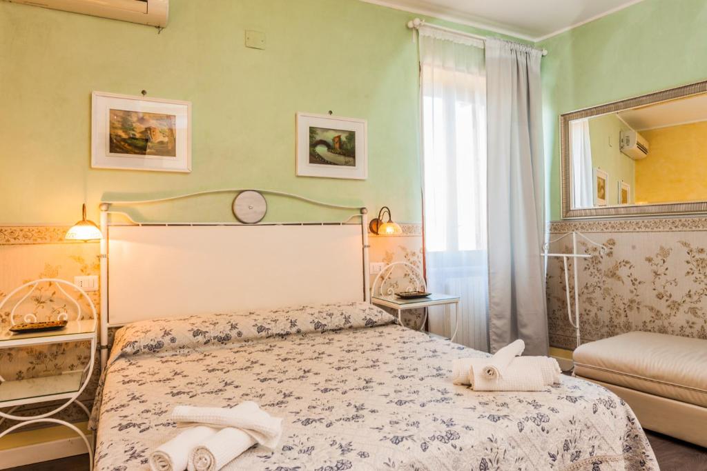Postel nebo postele na pokoji v ubytování Albergo Della Corte