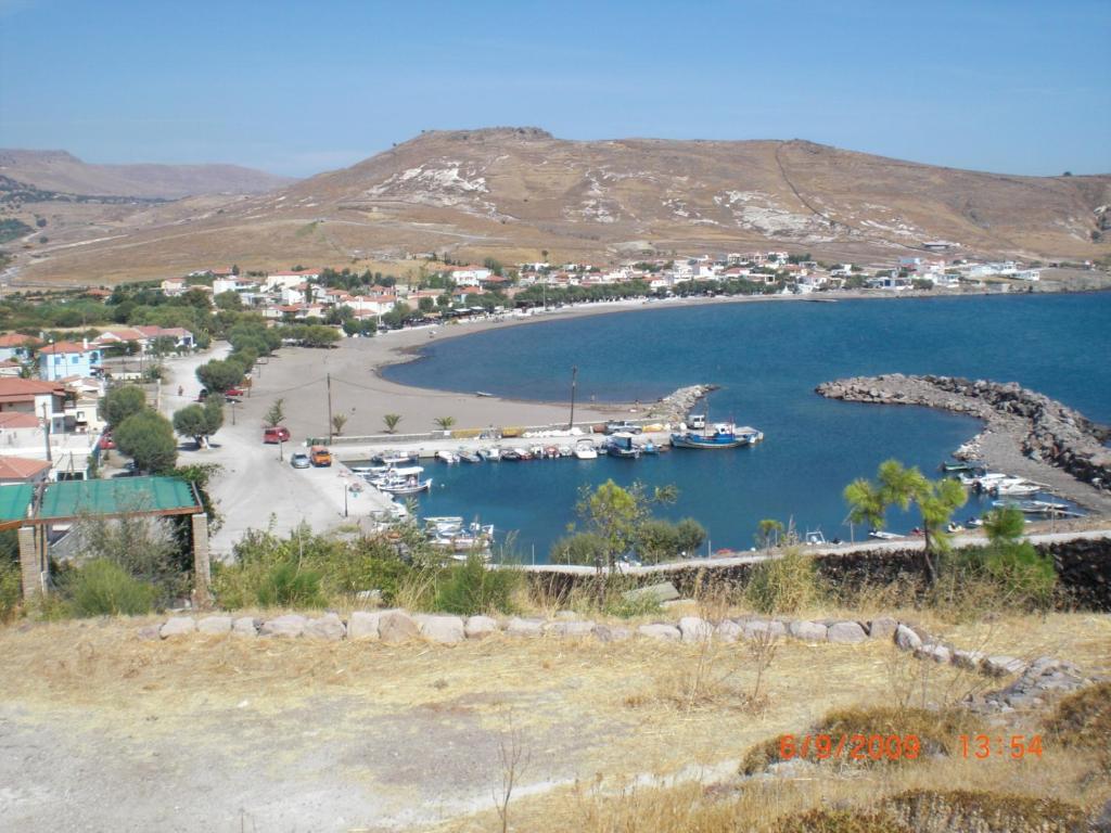 a view of a harbor with boats in the water at Sea Front two bedroom House in Lesvos in Tavari