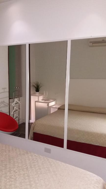 Postel nebo postele na pokoji v ubytování Albergo Della Corte